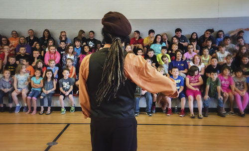 Playing violin for school kids